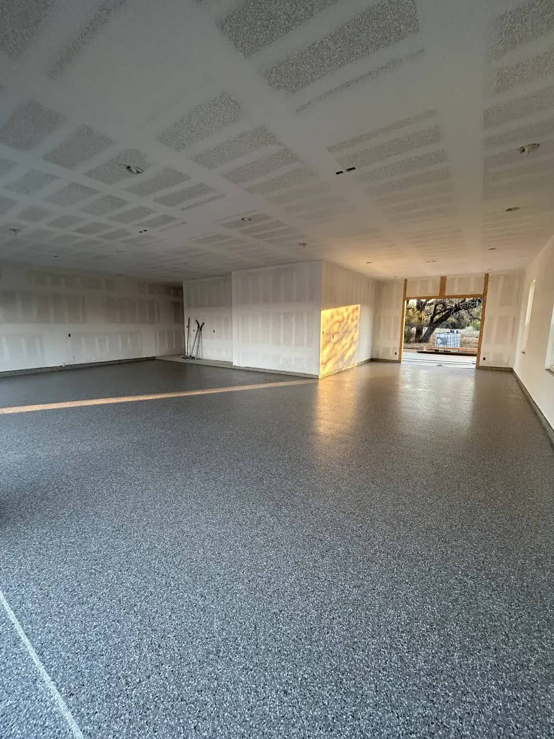 Open great room finished with a seamless flake coating