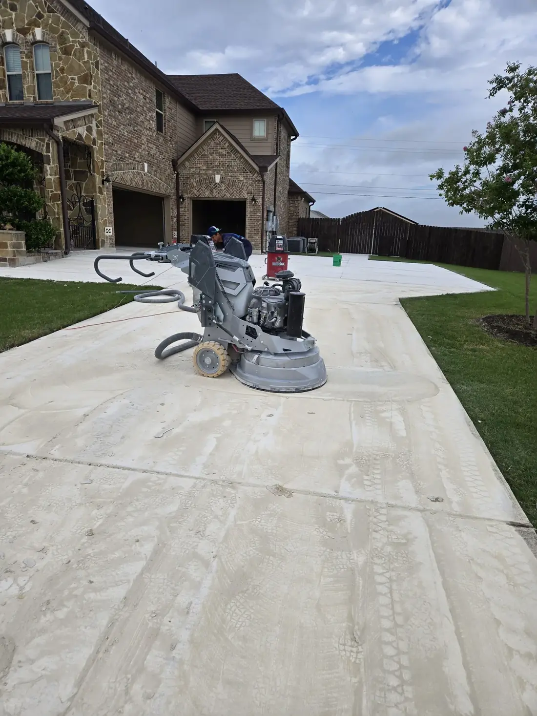 Blupoxy crew grinding a concrete surface before coating