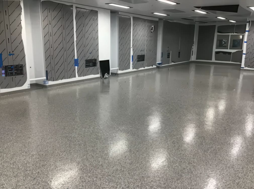 Commercial warehouse floor with a grey flake epoxy coating