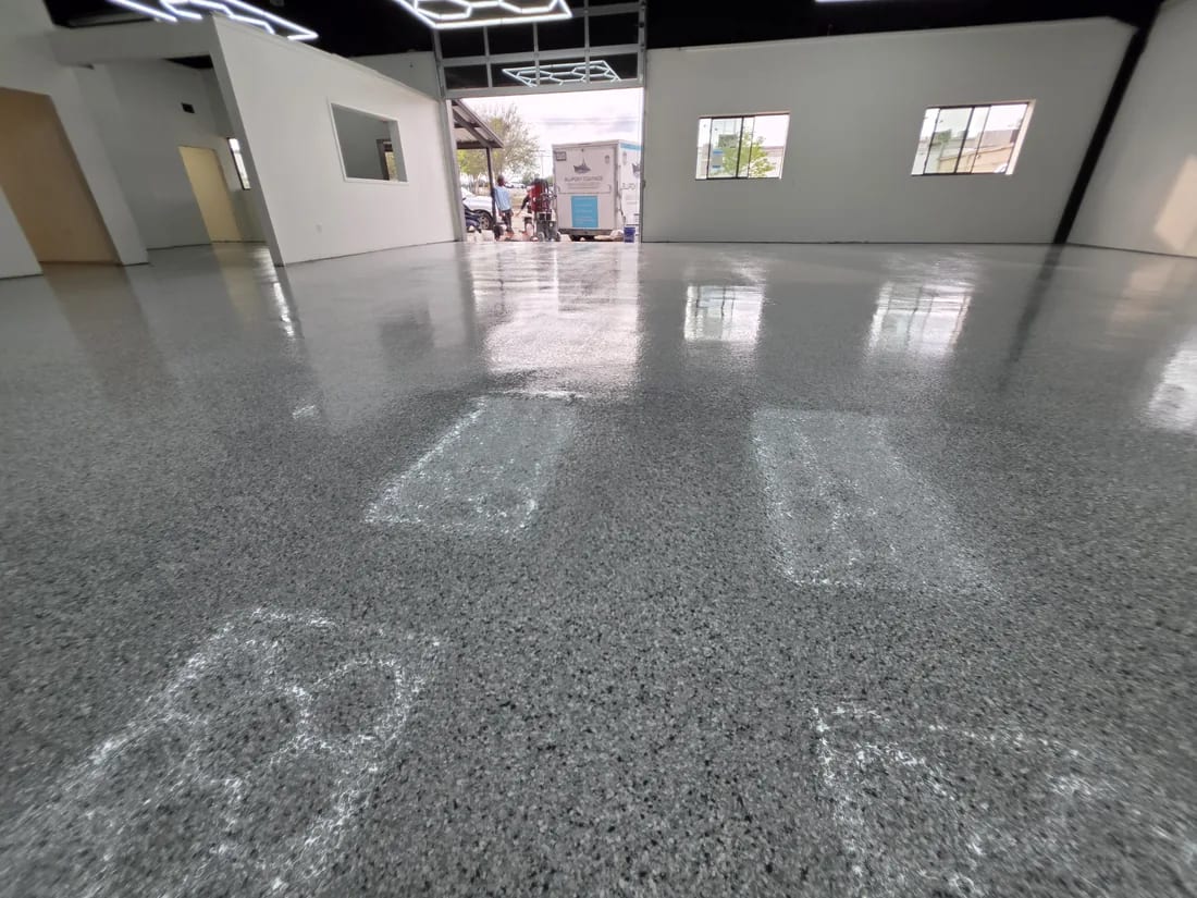 Commercial interior floor finished with a durable epoxy coating system