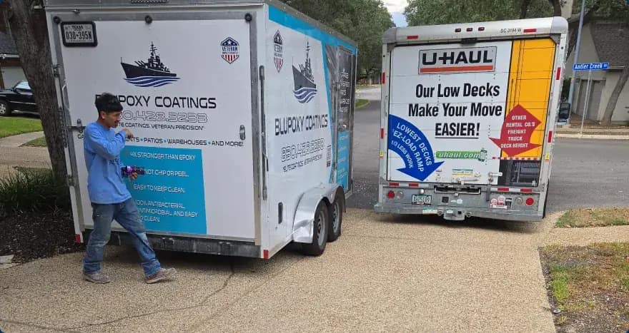 Blupoxy Coatings crew and branded work trailer on a job site