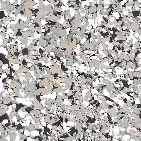 Close-up of a speckled, multi-colored surface featuring irregular, overlapping shapes in shades of grey, white, and tan. No recognizable landmarks visible.