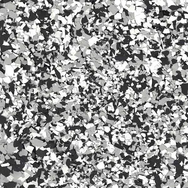 A textured surface with a pattern of monochrome flakes scattered across the image, creating an abstract and modern appearance.