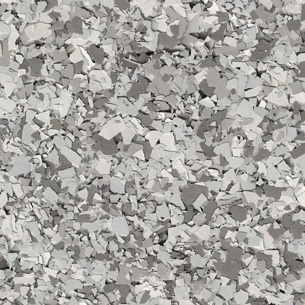 A close-up view of a textured surface, featuring numerous irregularly shaped, grayish-white fragments closely packed together, creating an abstract, rocky appearance.