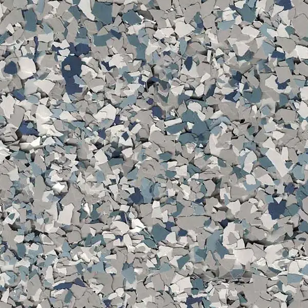 A random pattern of gray, blue, and white flakes creating a speckled texture, resembling a camouflaged or terrazzo-like surface.