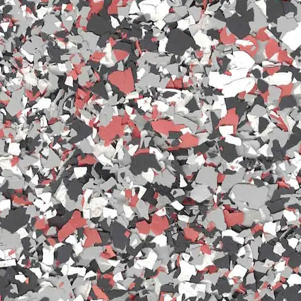The image shows a close-up of a multicolored, textured surface with red, gray, black, and white speckled fragments.
