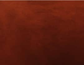 The image displays a smooth, textured surface in a rich, dark brown color, resembling leather or polished wood. No landmarks or buildings visible.
