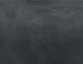A textured black surface resembling a chalkboard with no noticeable landmarks, buildings, or people present in the image.